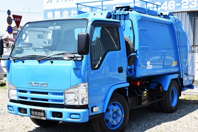 A packer truck being prepared for shipment